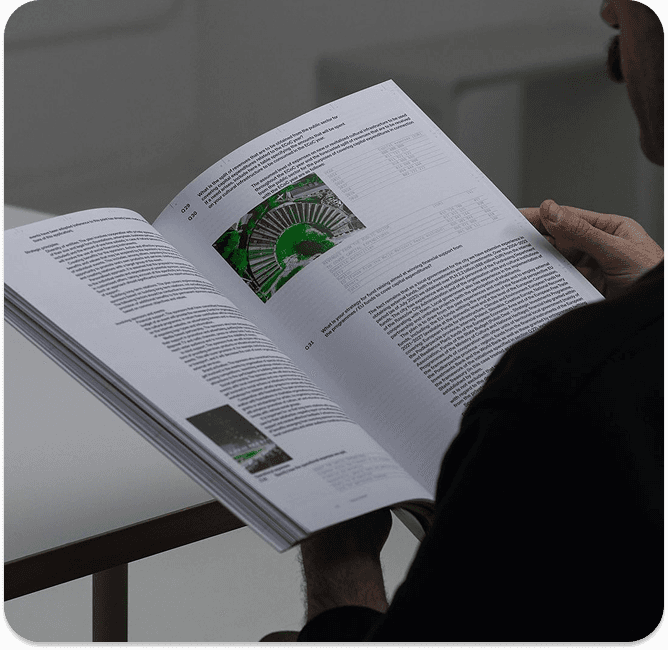 Reading book with green illustration